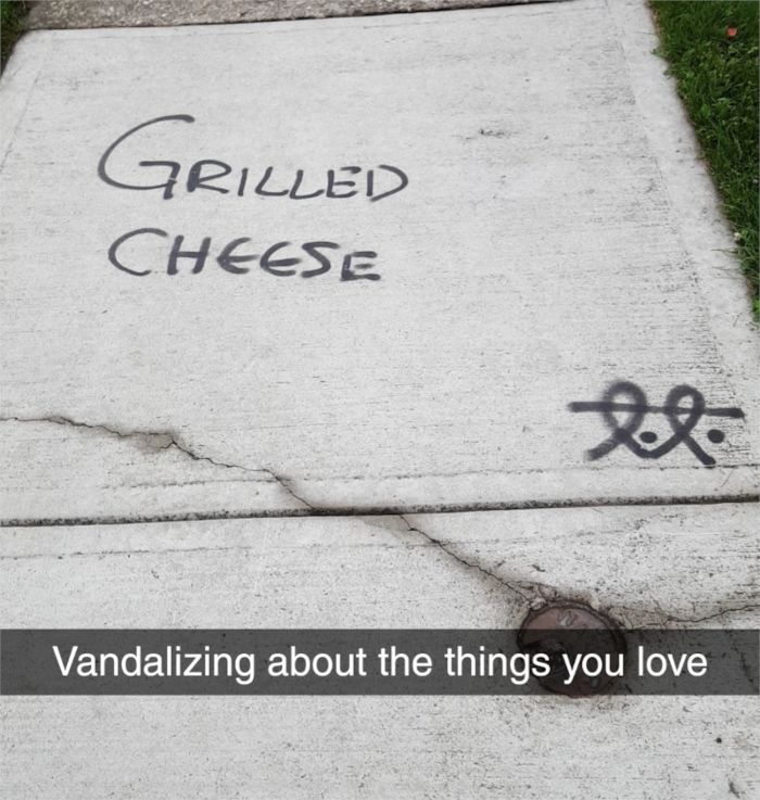 scott grilled cheese is vandalized on the sidewalk