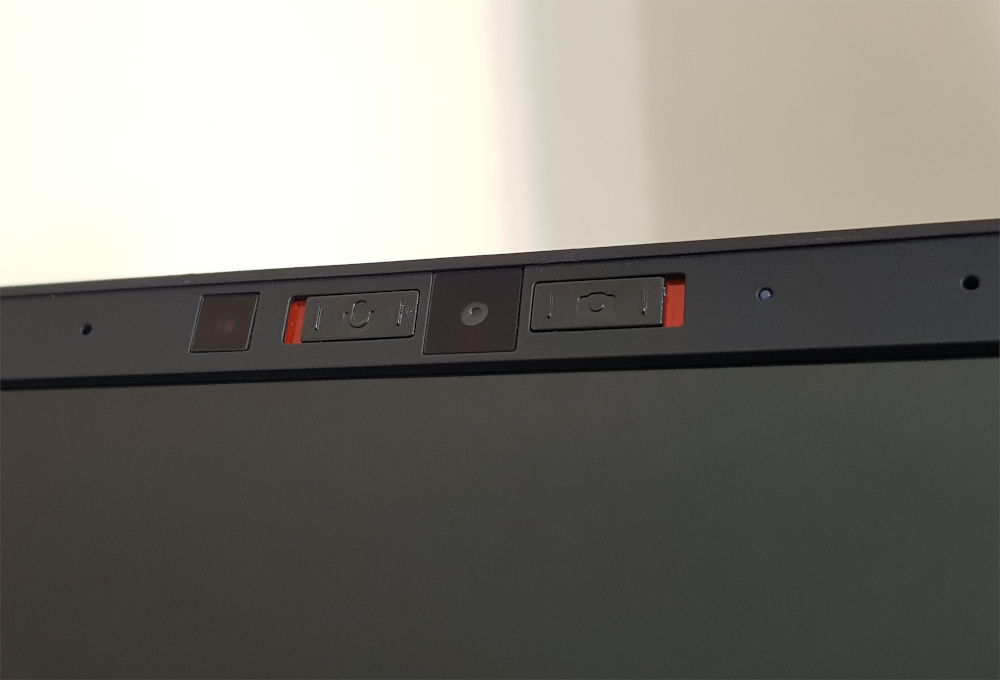 the Framework bezel with provided camera and microphone kill switches