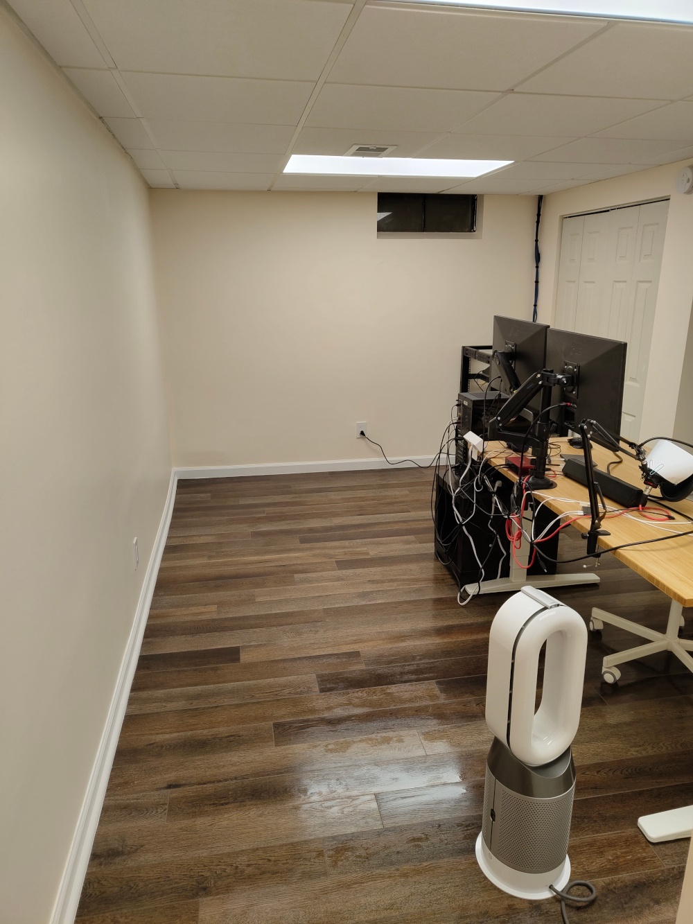 A picture of my home office with finished walls. The painting supplies and tarps are put away and the floor has just been mopped.